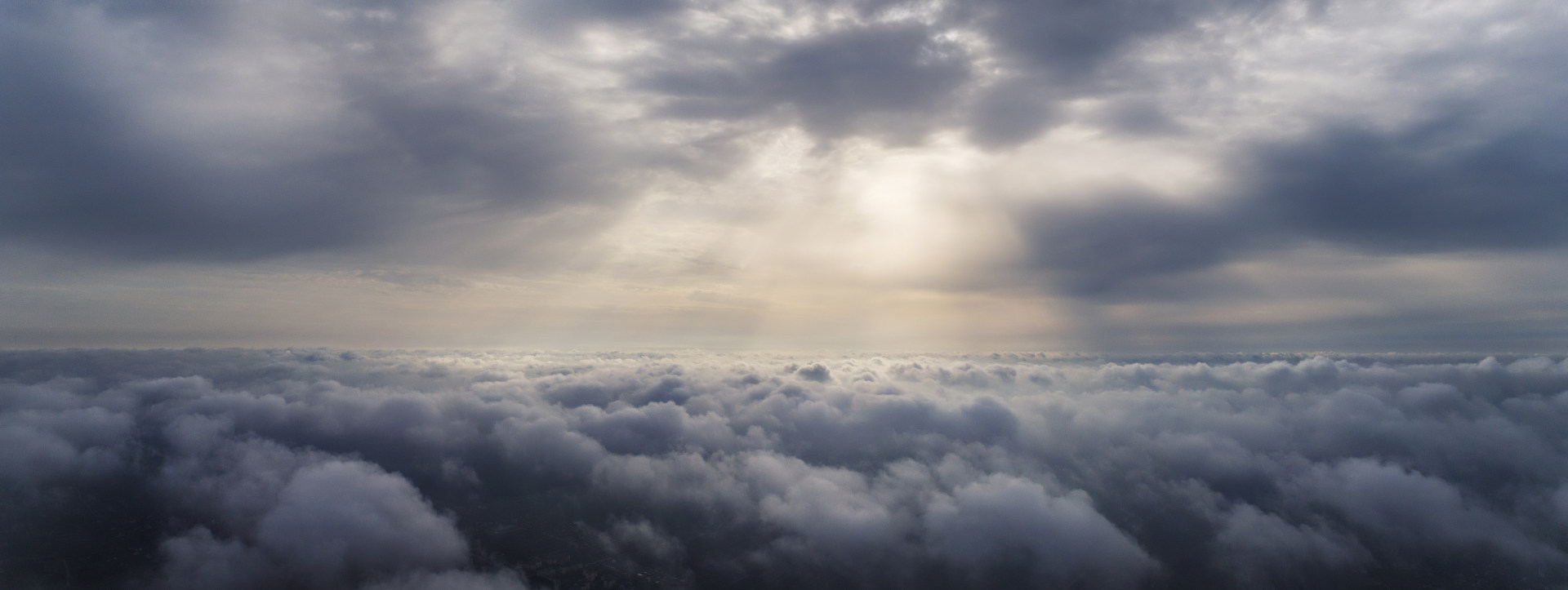 gliding above low clouds