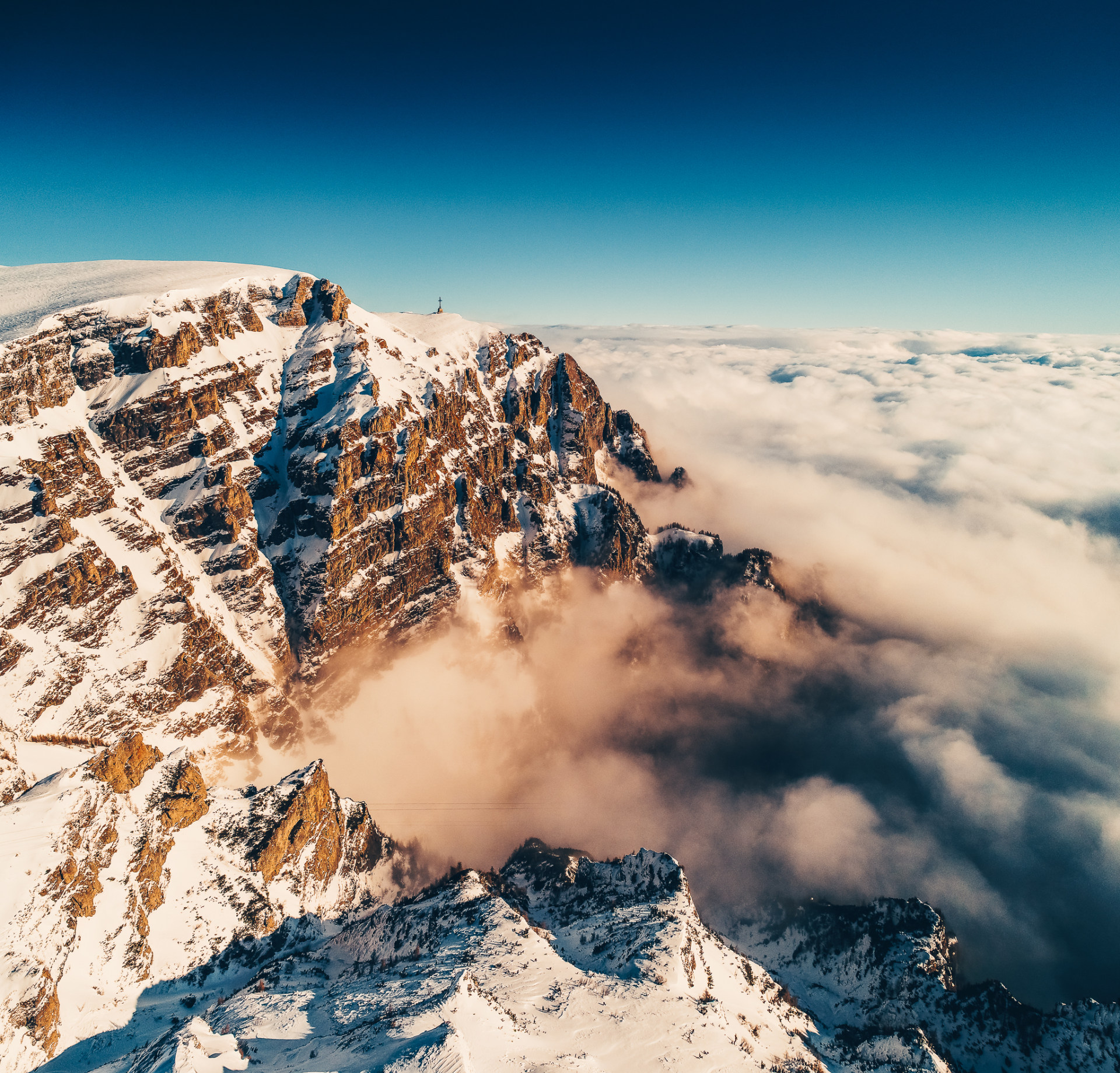bucegi mountains over the sea of clouds