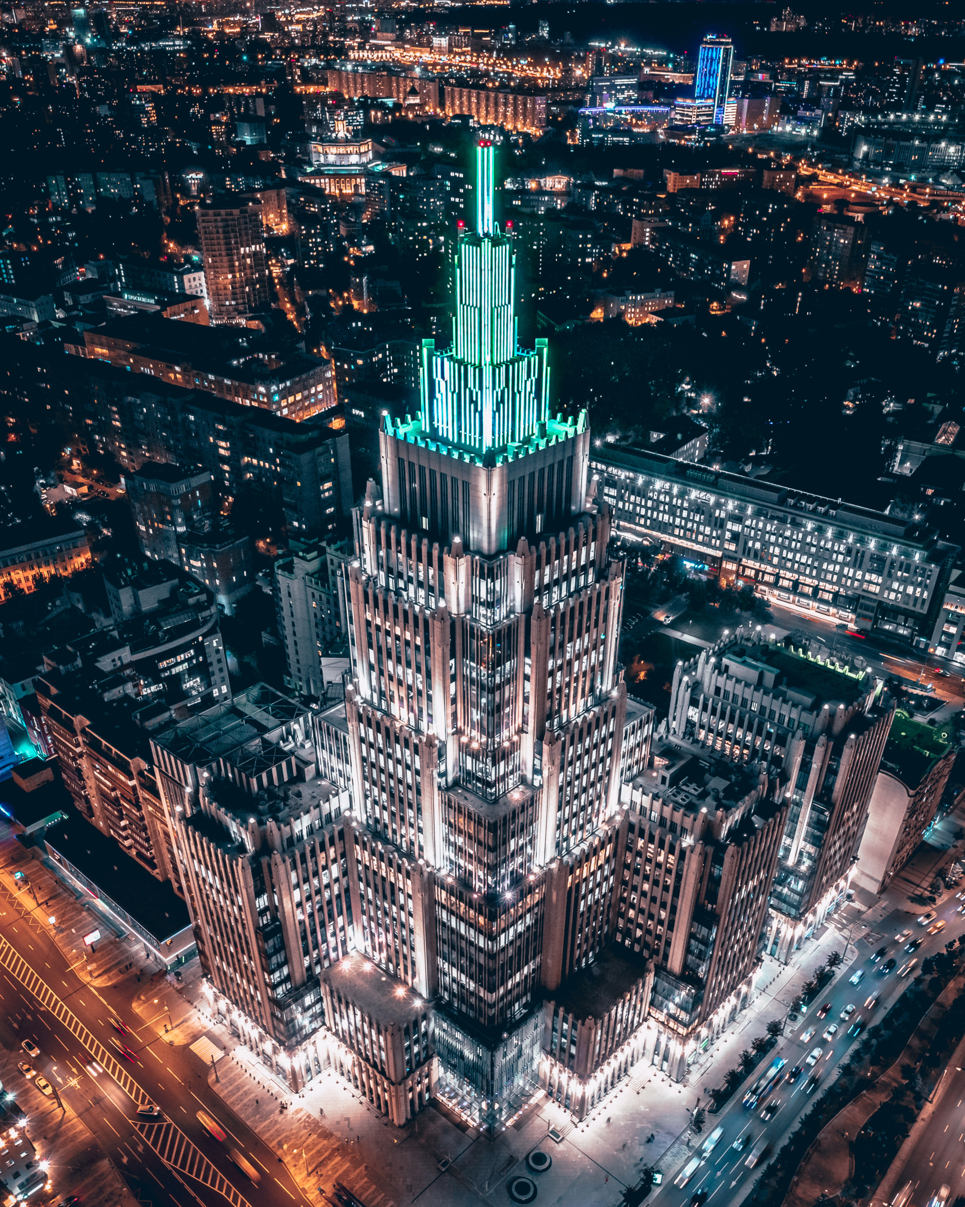 Business center Oruzheiniy. Shot was taken in September in Moscow. This building can be seen from afar and it is like an ancient sacred place, to which crowds of people flock. It really looks like an ancient ziggurat in a modern interpretation built at the crossroads. It looks especially incredible at night with a glowing green spire