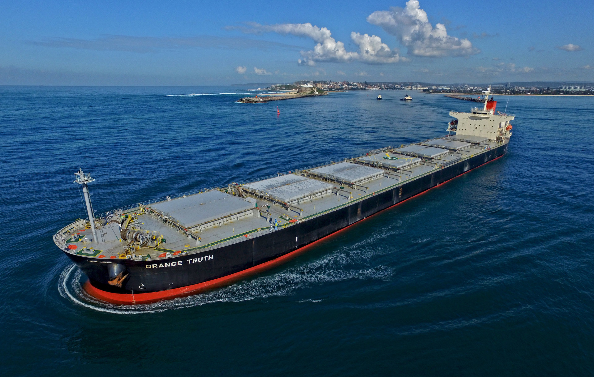coal turns its bow to the sea as it leaves the port of newcastle