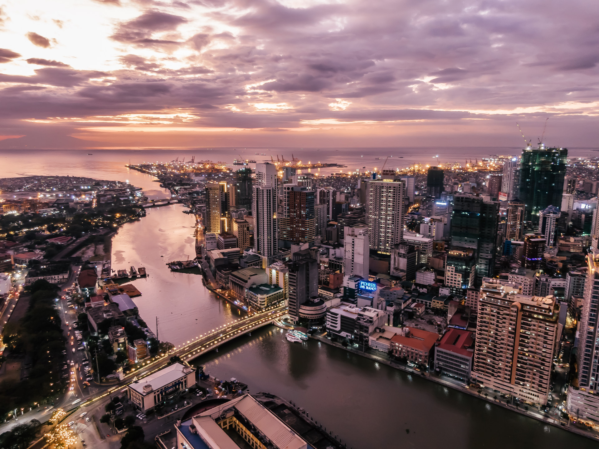 skyline of metro manila while sunset