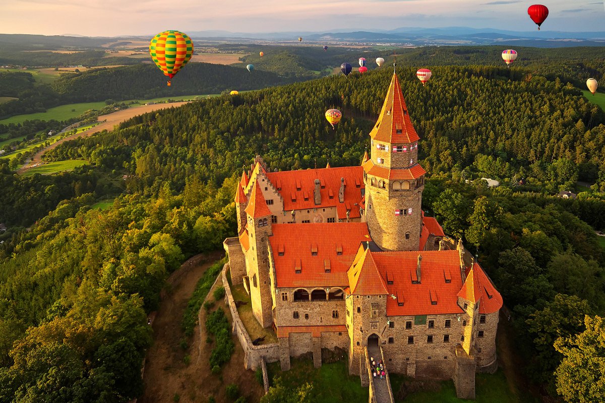 hot air balloons over fairy-tale castle